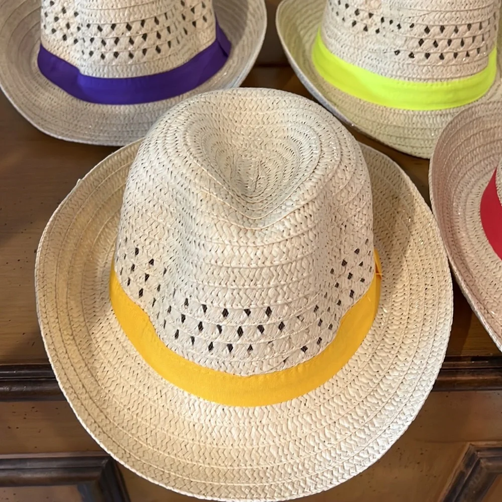 Straw adult fedora style hats.